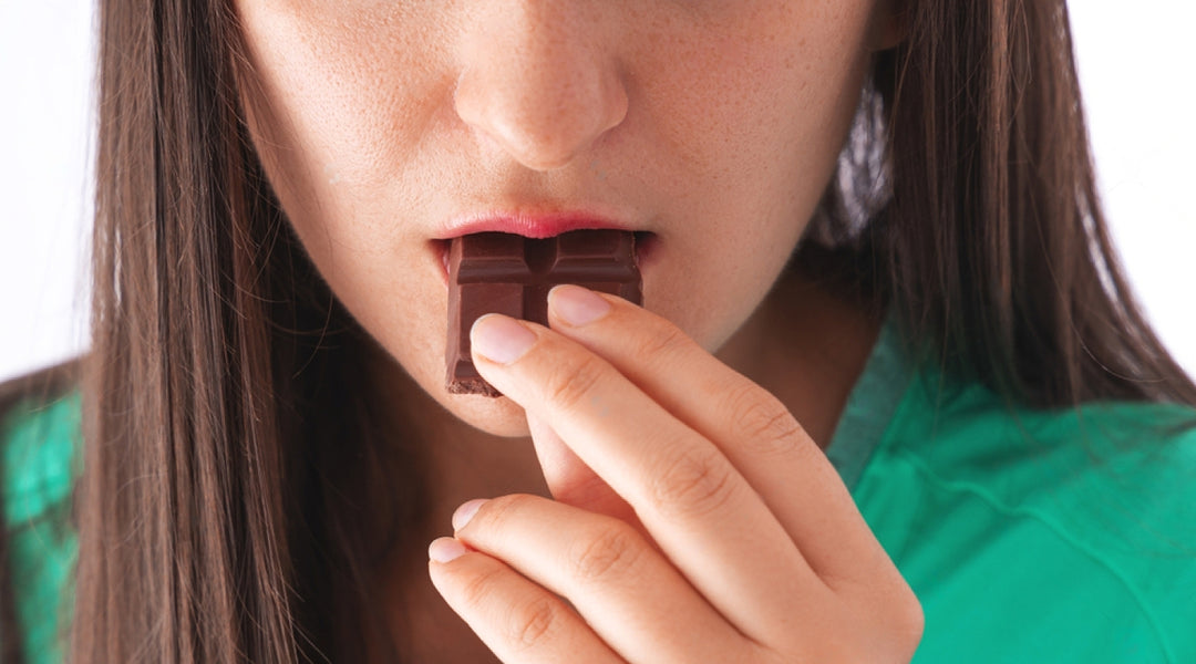 Girl eating mushroom chocolate